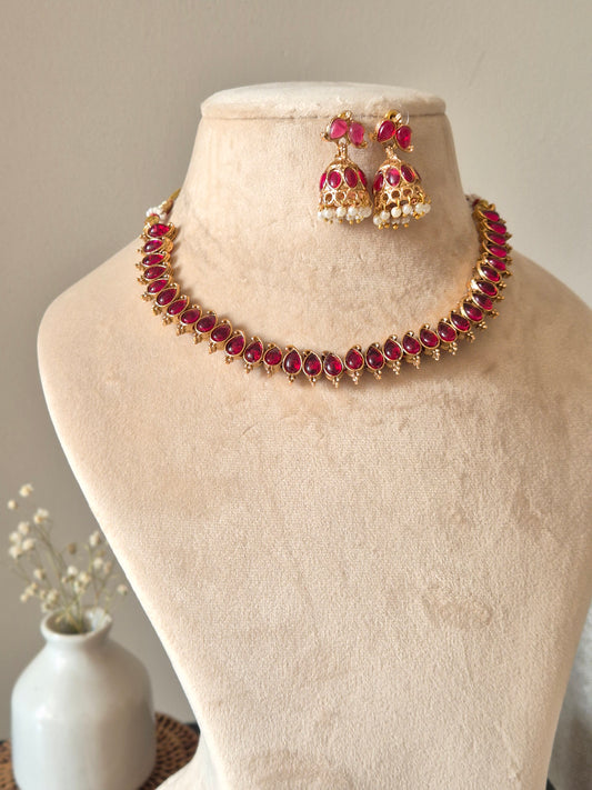 Unique reversible necklace set with pink, red, and green enamel, shown from multiple angles to illustrate versatility