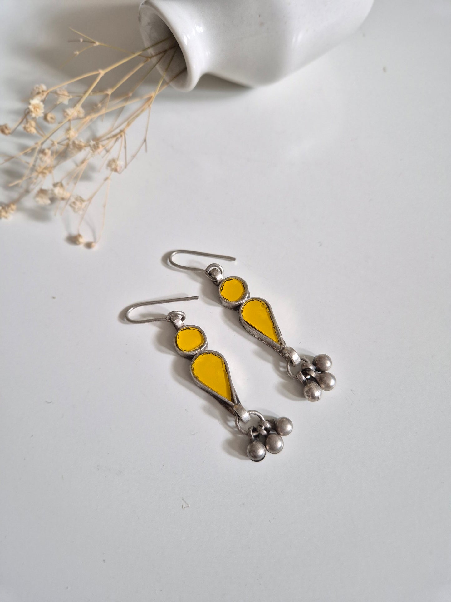 Yellow glass dangle earrings, close-up for handmade detail