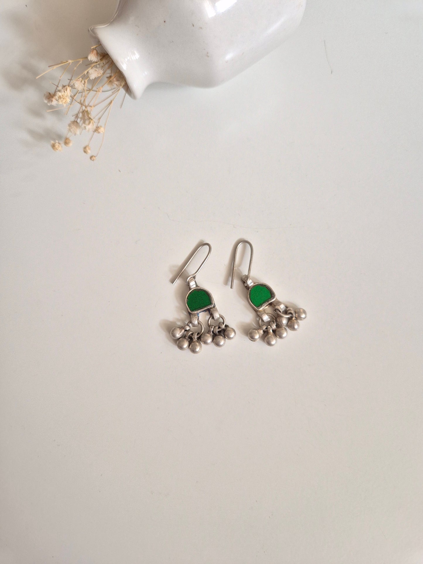 Green glass dangle earrings upright, artisanal finishing