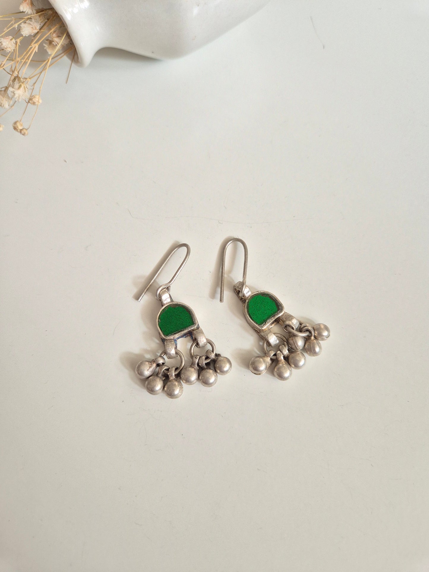 Green glass dangle earrings upright, artisanal finishing