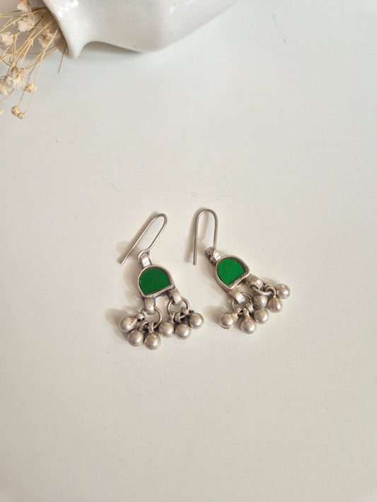 Green glass dangle earrings upright, artisanal finishing