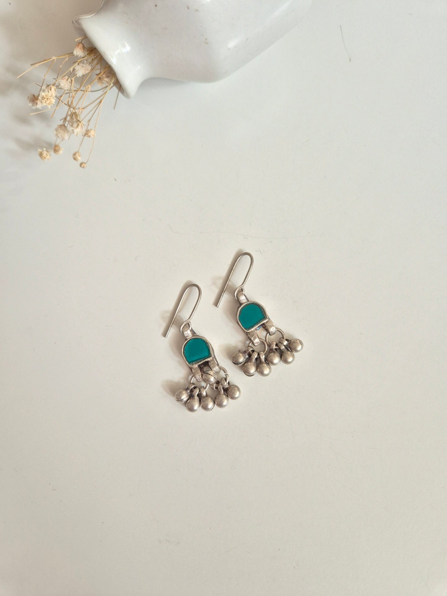 Silver glass dangle earrings, modern design, metalwork detail