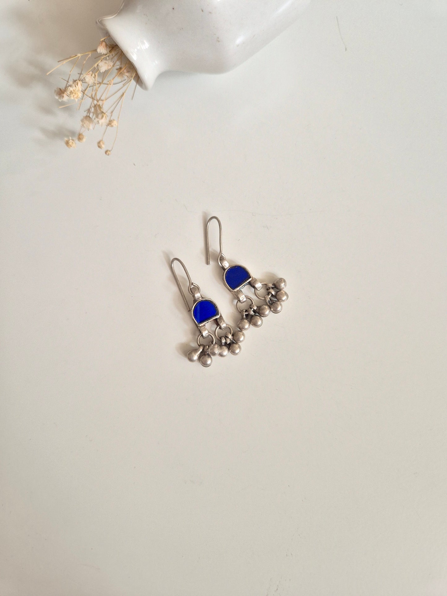 Blue glass and metal dangle earrings, detailed and hand-finished
