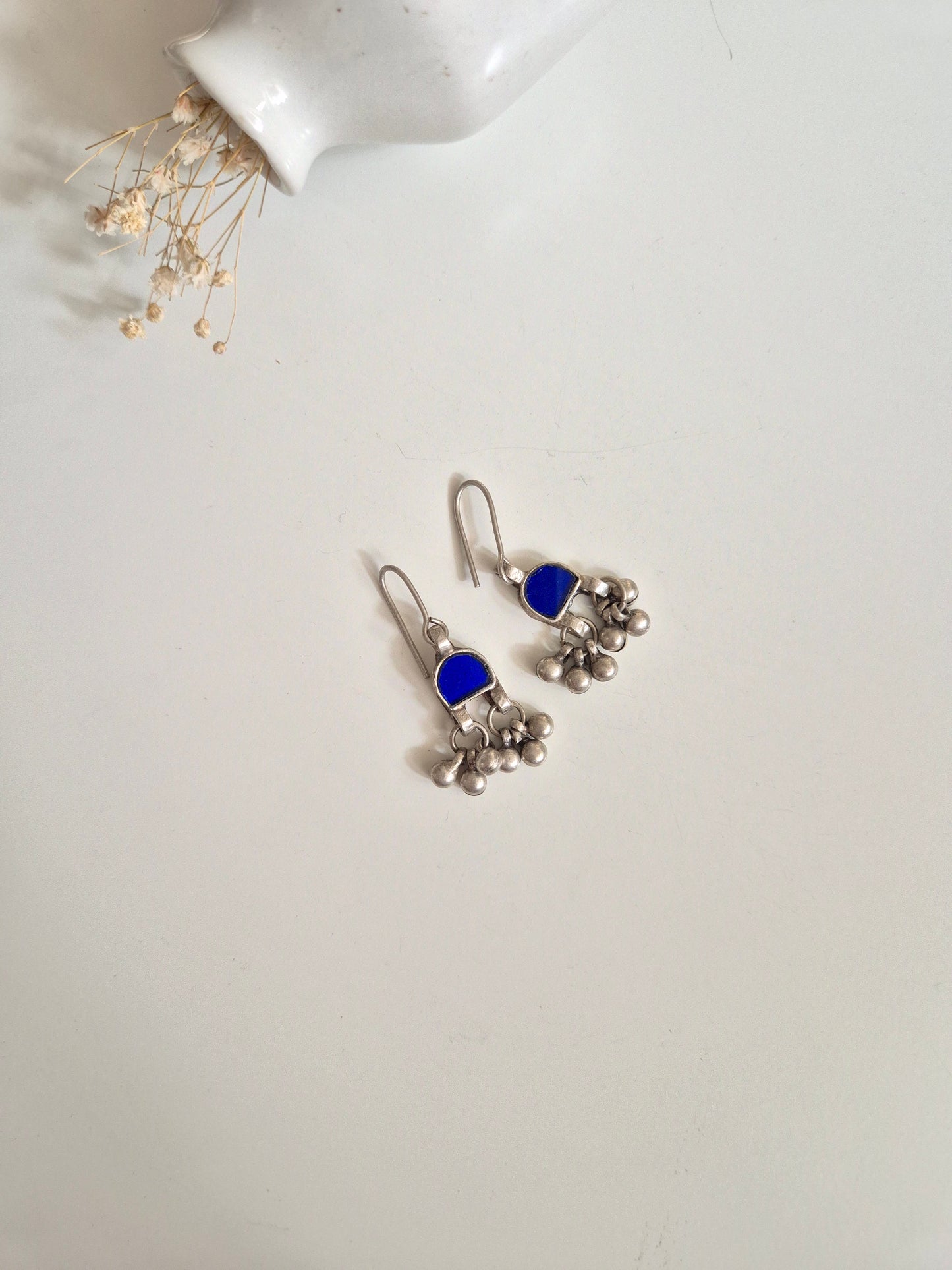 Blue glass and metal dangle earrings, detailed and hand-finished