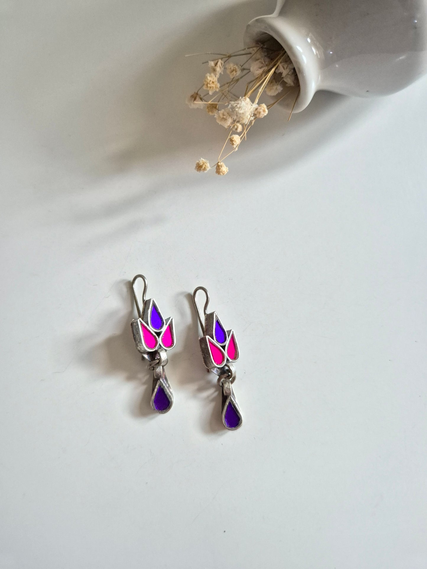 Purple and pink glass dangle earrings, Nisha Glass Earrings by Naitri, silver hooks displayed.