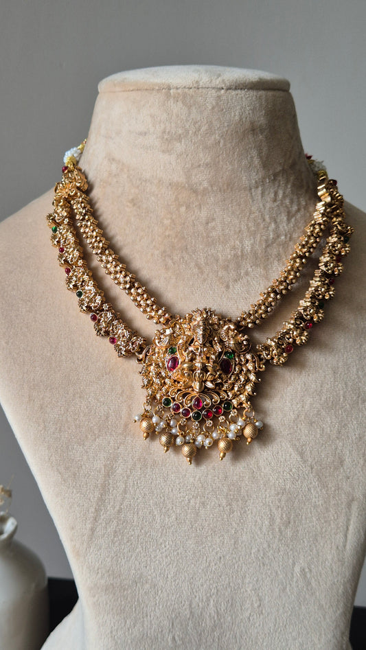 Gold necklace set, Aruna by Naitri, premium festive jewelry on white background.