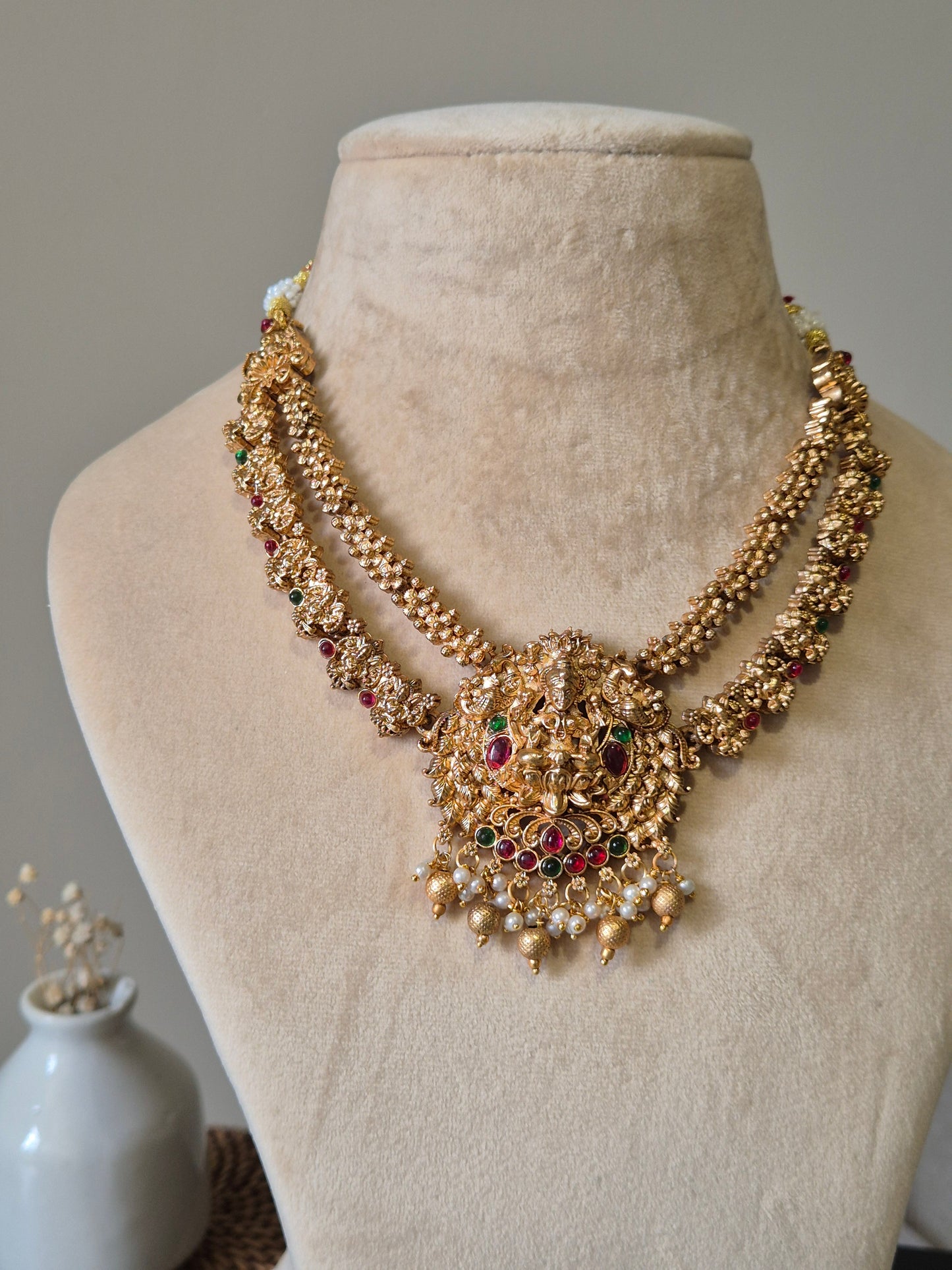Gold necklace set, Aruna by Naitri, premium festive jewelry on white background.