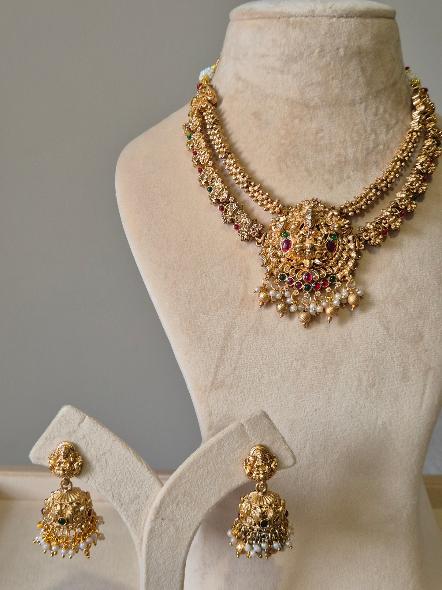 Gold necklace set, Aruna by Naitri, premium festive jewelry on white background.