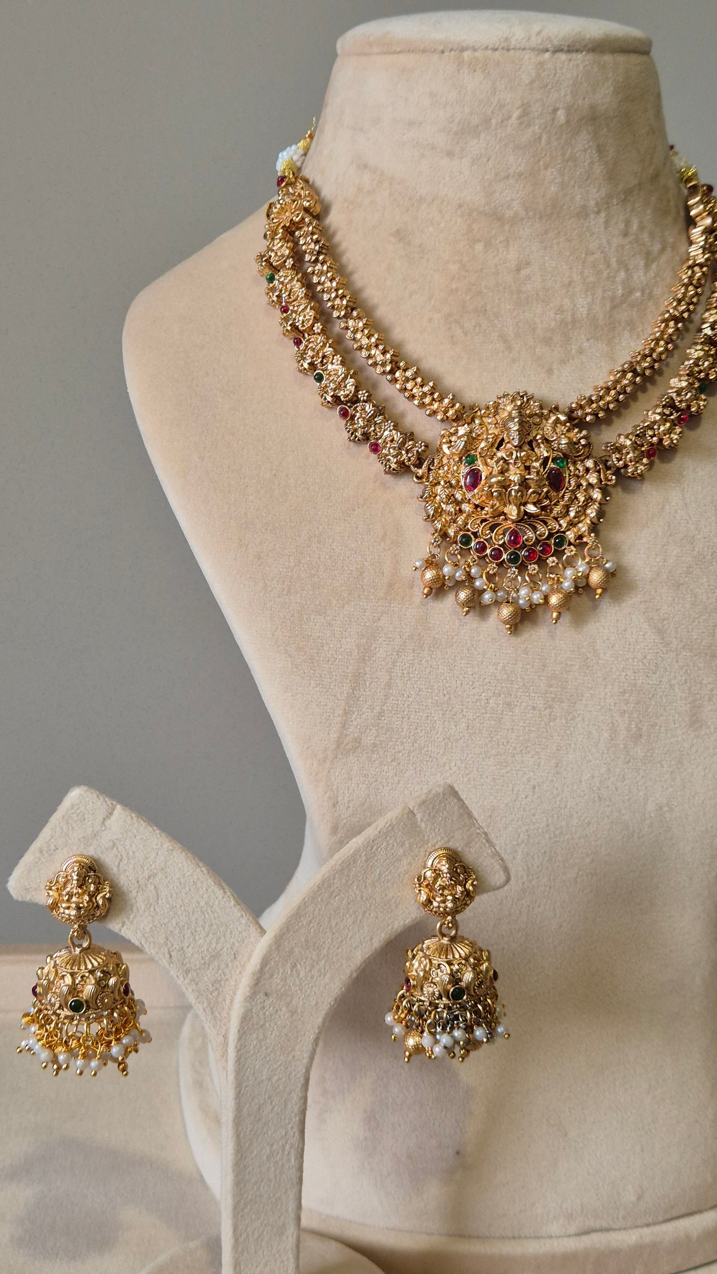 Gold necklace set, Aruna by Naitri, premium festive jewelry on white background.