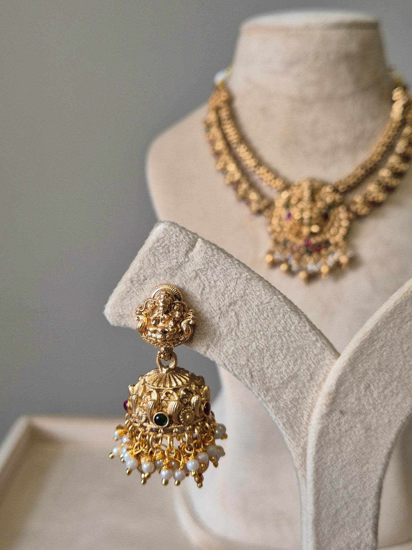 Gold necklace set, Aruna by Naitri, premium festive jewelry on white background.