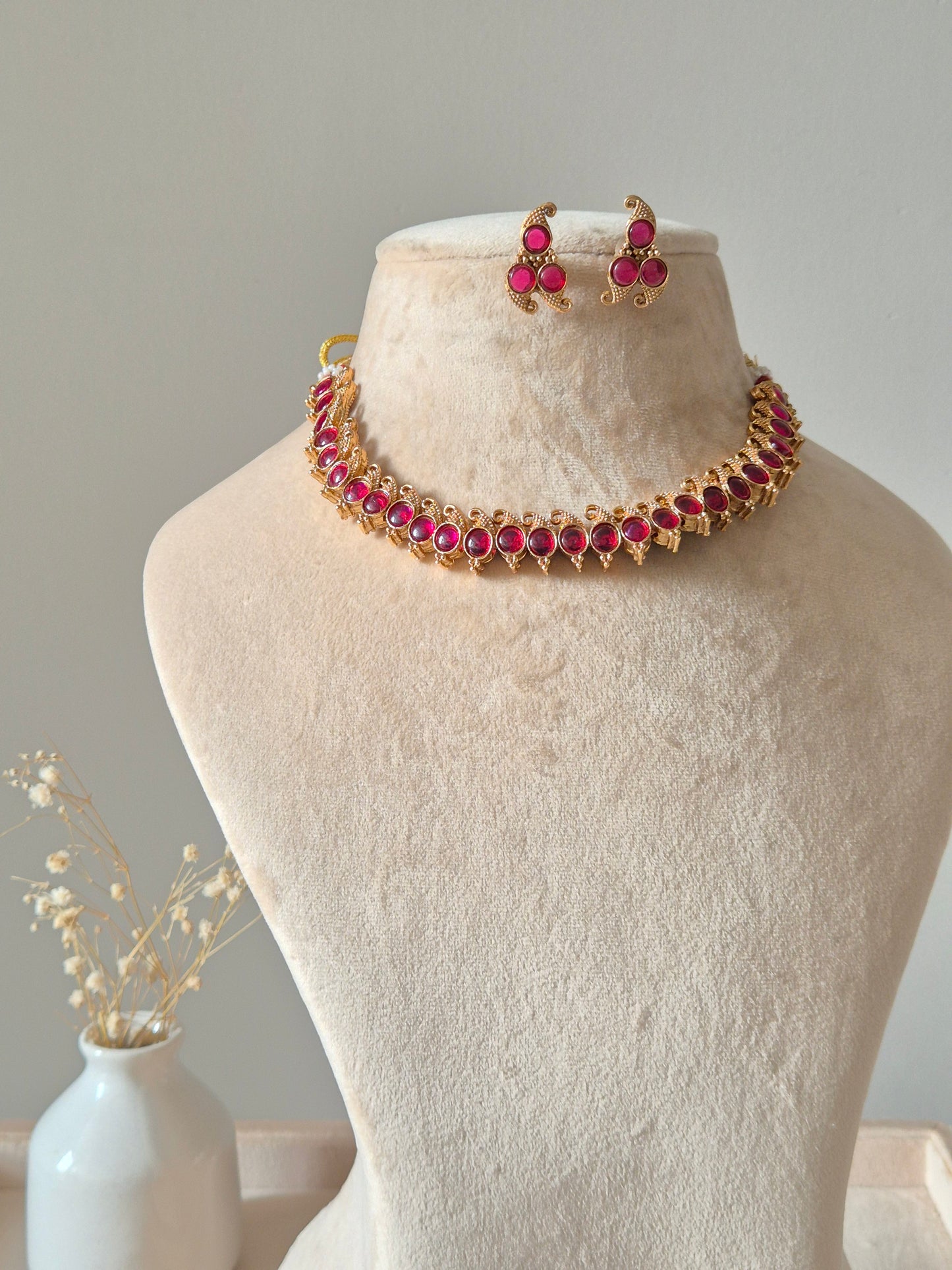 Reversible gold pendant necklace set, Kavi by Naitri, with stud earrings.