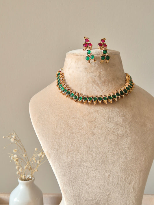 Reversible gold pendant necklace set, Kavi by Naitri, with stud earrings.