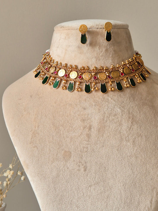 Gold choker necklace set, Meetu by Naitri on bust form.