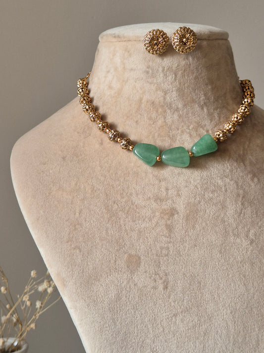 Gold and green beaded necklace set, Shifa by Naitri, displayed on bust.