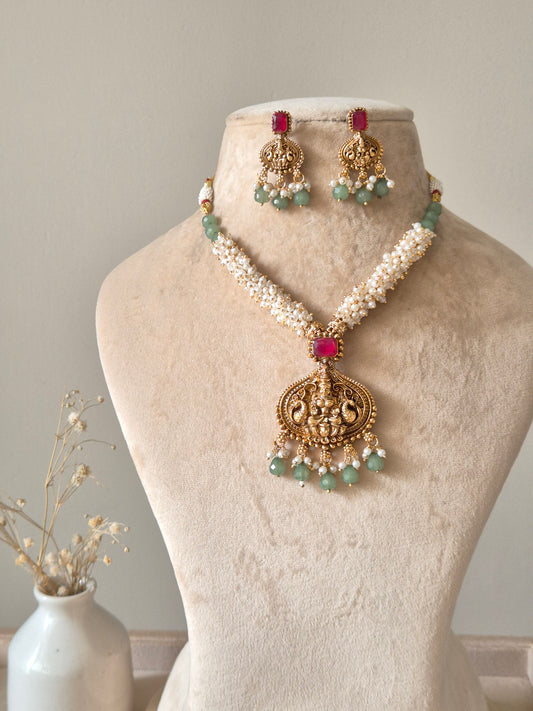 Multi-strand gold beaded necklace set, Richa by Naitri, with statement earrings.