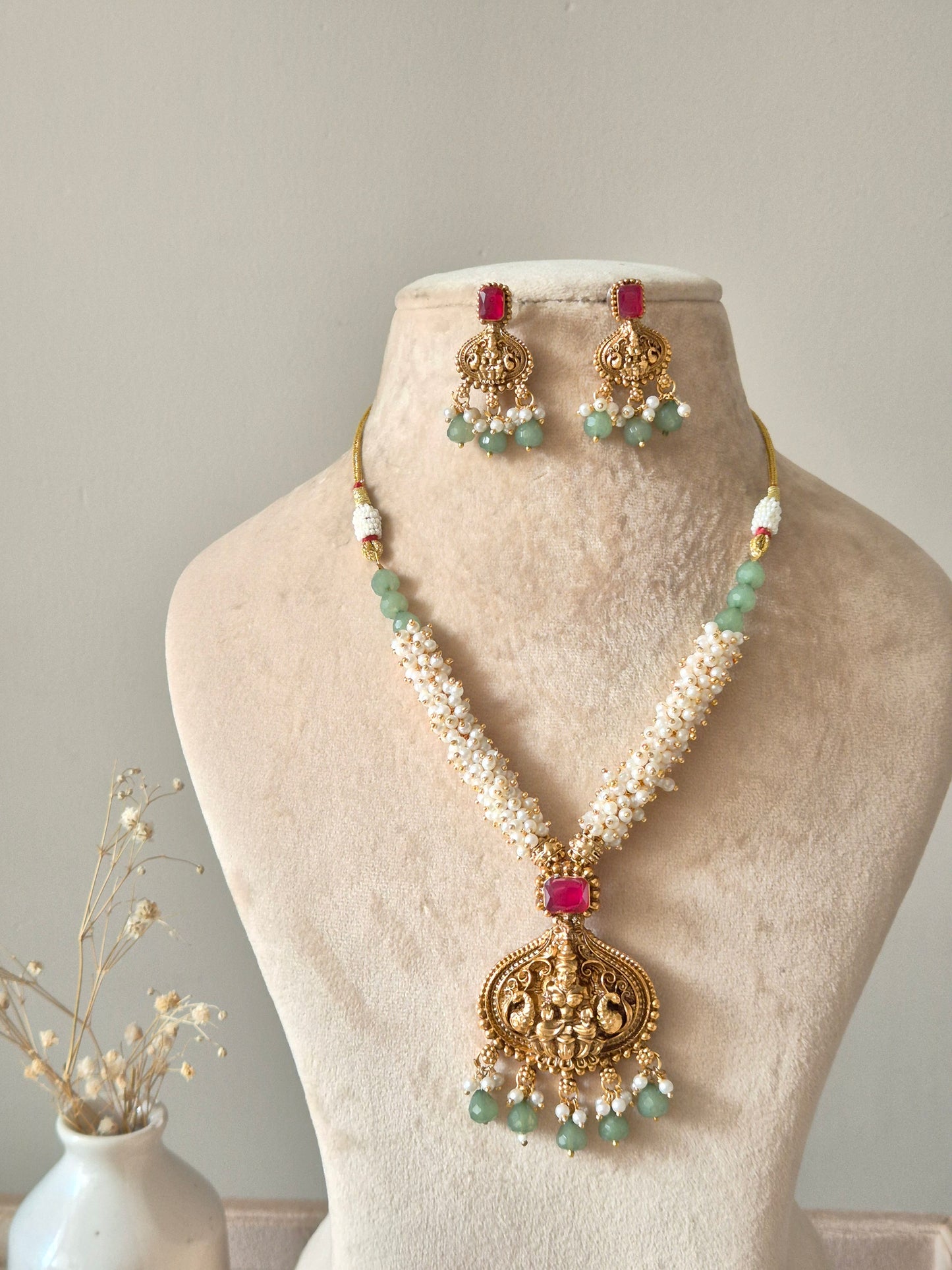 Multi-strand gold beaded necklace set, Richa by Naitri, with statement earrings.