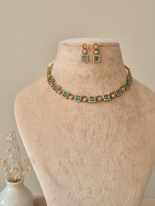 Blue and gold necklace set with clear stones, Tarang by Naitri on bust.