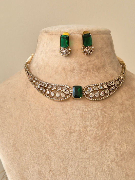 Polished gold necklace set with American diamond stones, Krishvi by Naitri.