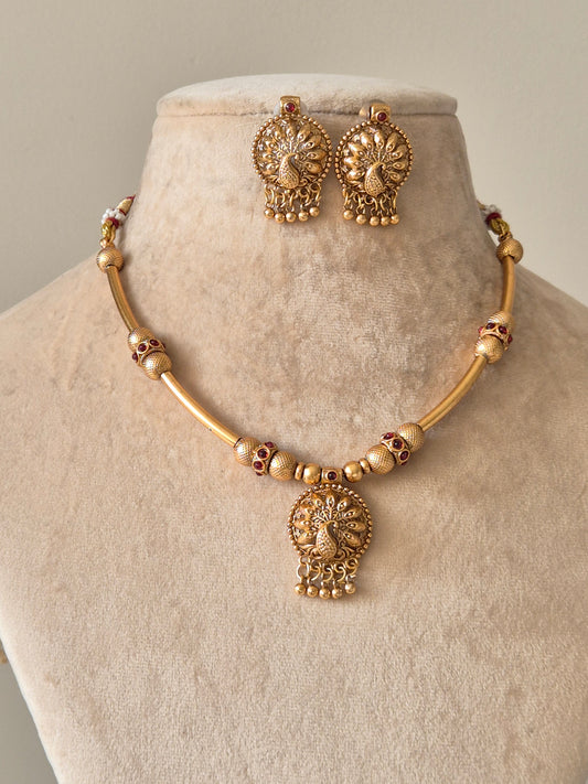 Gold beaded necklace with pendant, Shanaya by Naitri, displayed on white background.