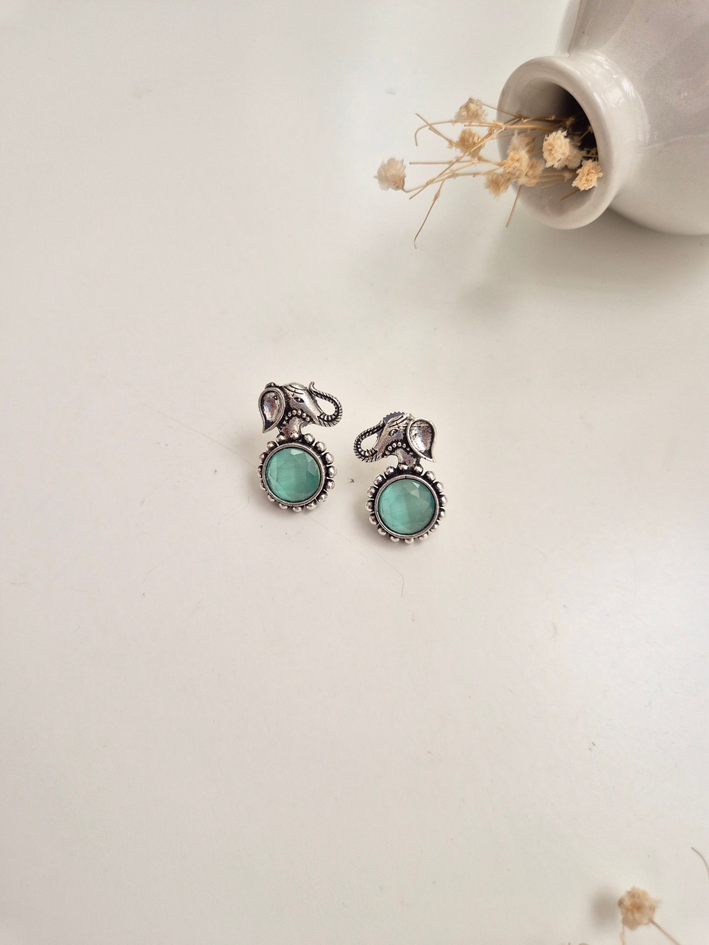 Handcrafted oxidized Kiara Earrings with silver and green accents, perfect for festive or casual.