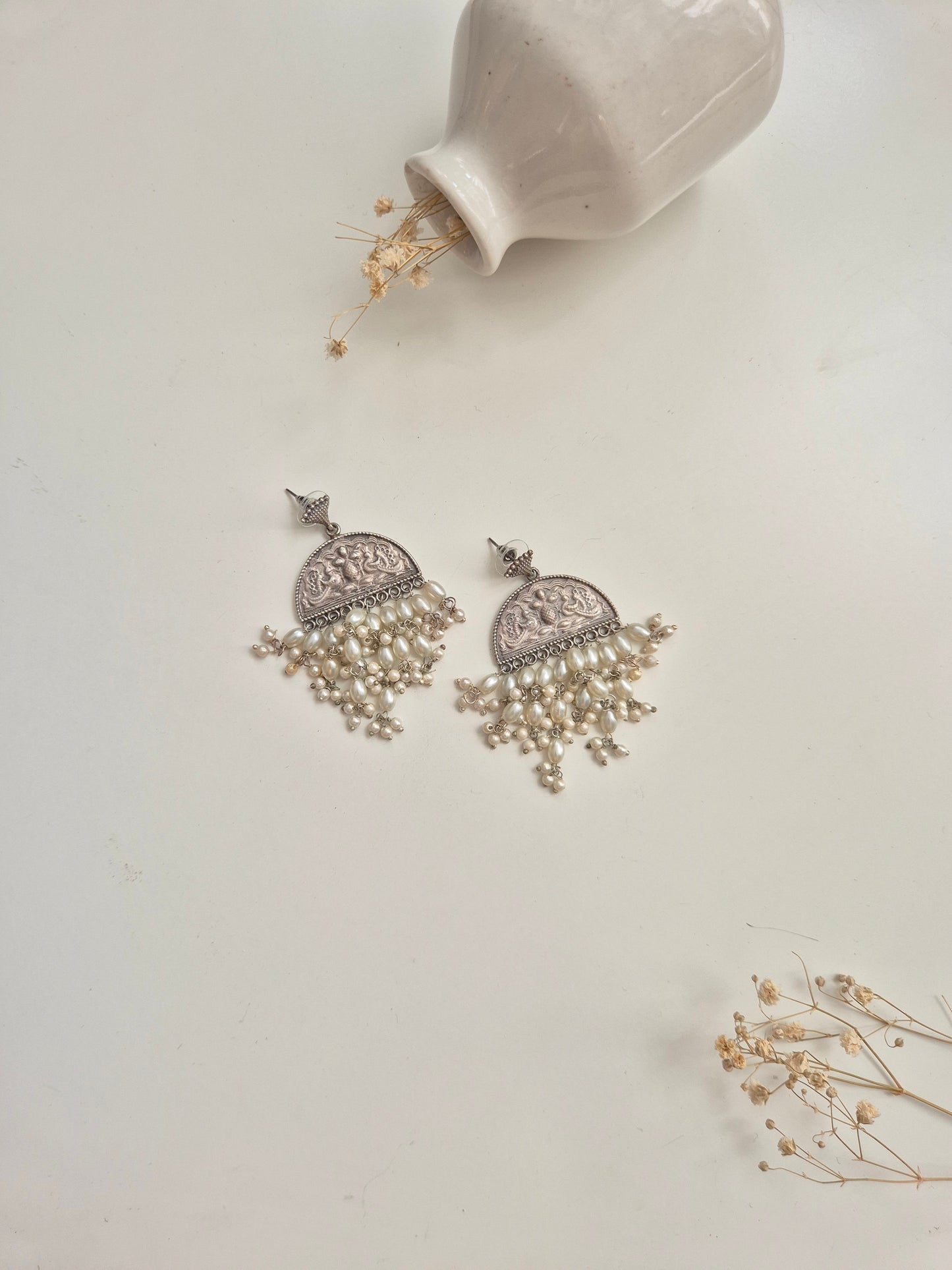 Elegant handcrafted oxidized Darshita Earrings, silver and red dangle style.