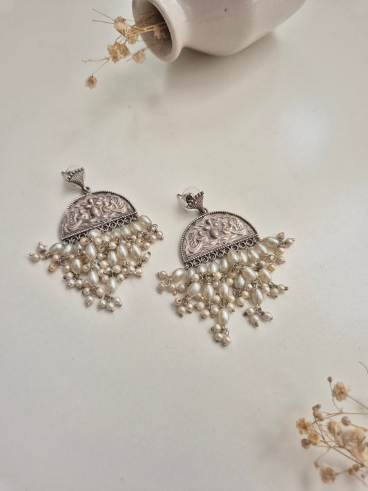 Elegant handcrafted oxidized Darshita Earrings, silver and red dangle style.