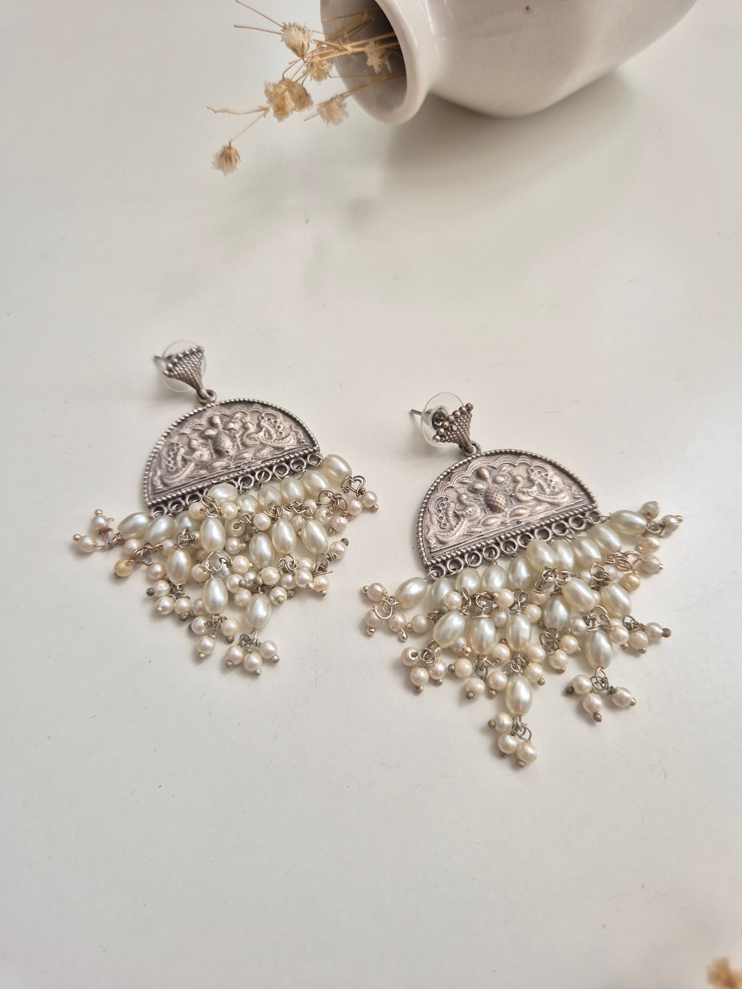 Elegant handcrafted oxidized Darshita Earrings, silver and red dangle style.