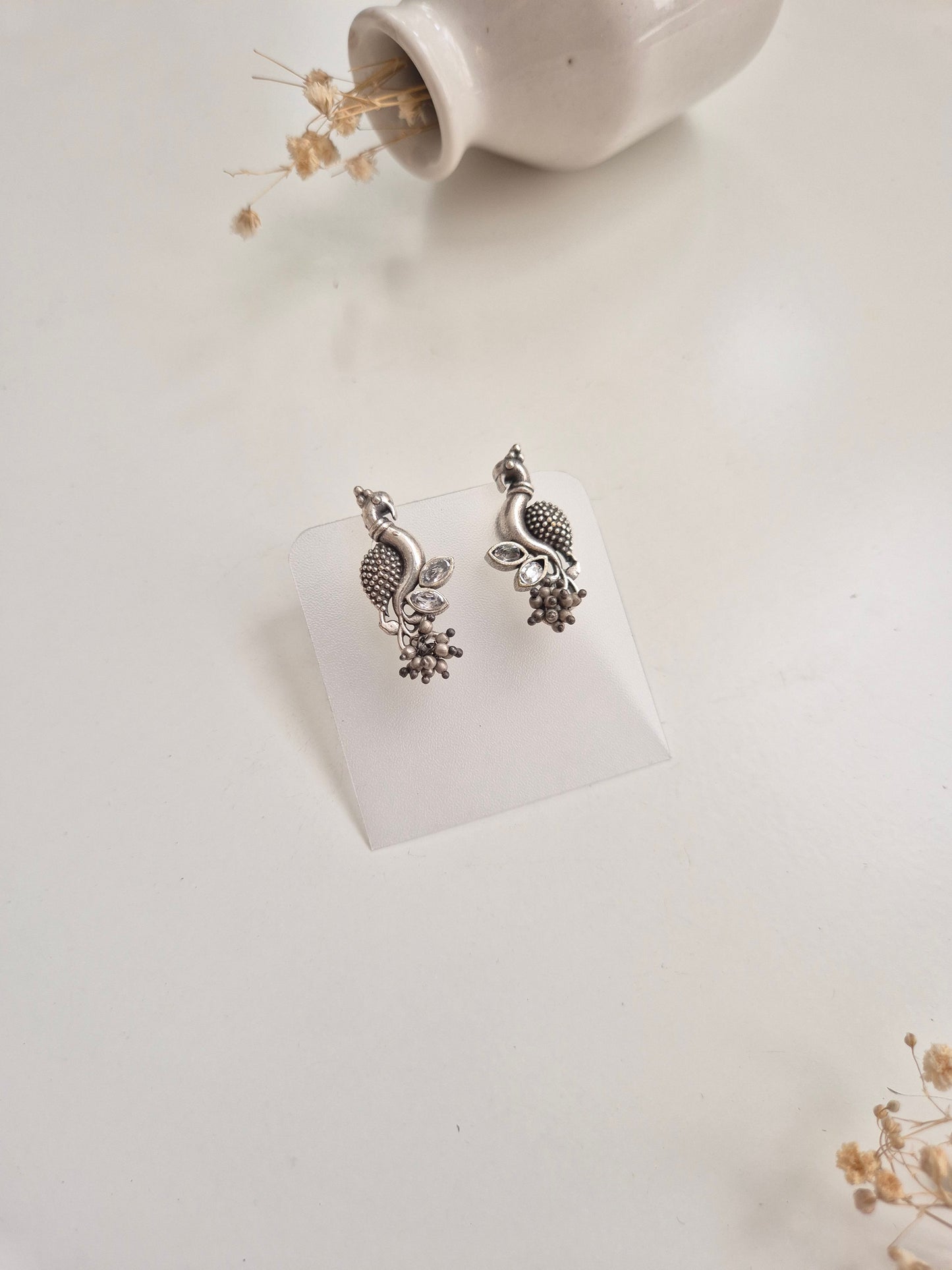 Premium handcrafted oxidized Hemal Earrings with silver and red dangle design.