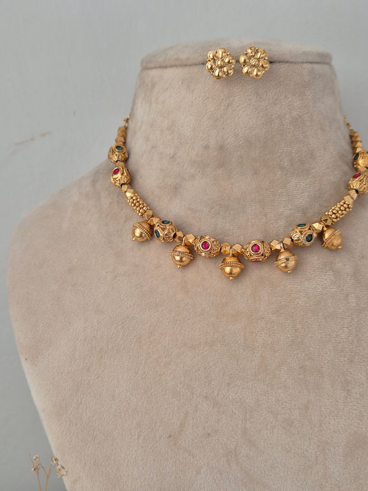 Lekhani red and green stone embellished gold necklace set