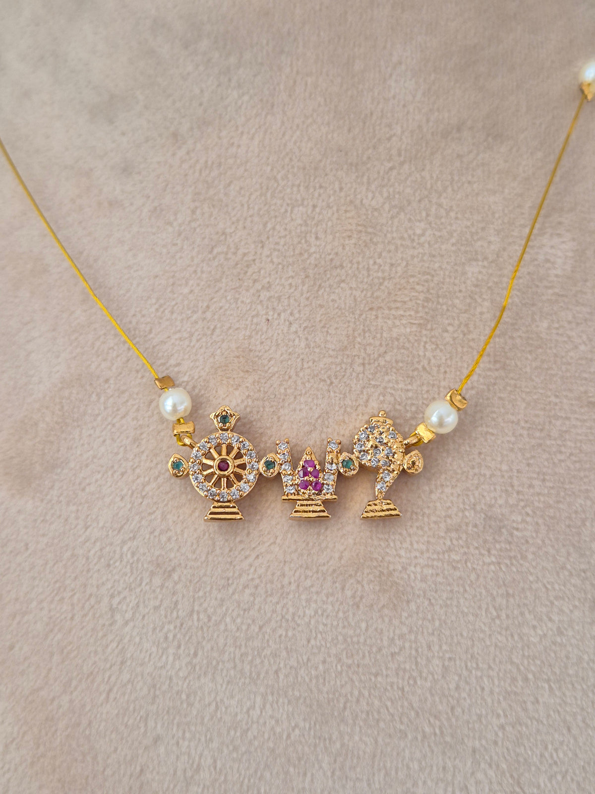 Naitri Wafa Invisible Chain Necklace crafted with traditional gold-toned temple motifs and delicate pearl details