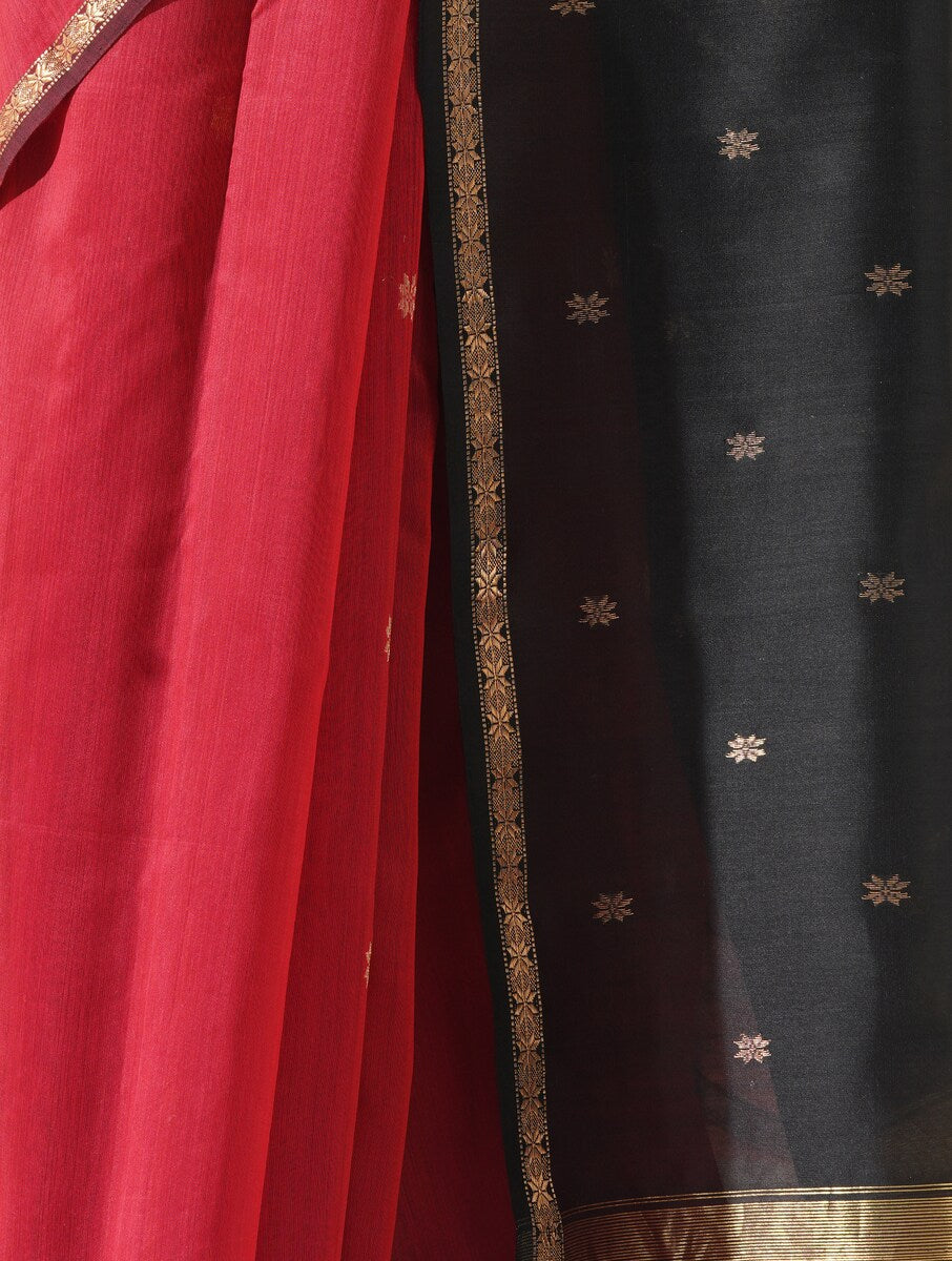 Red and black Maheshwari saree displayed on mannequin, showcasing traditional weave and fabric quality