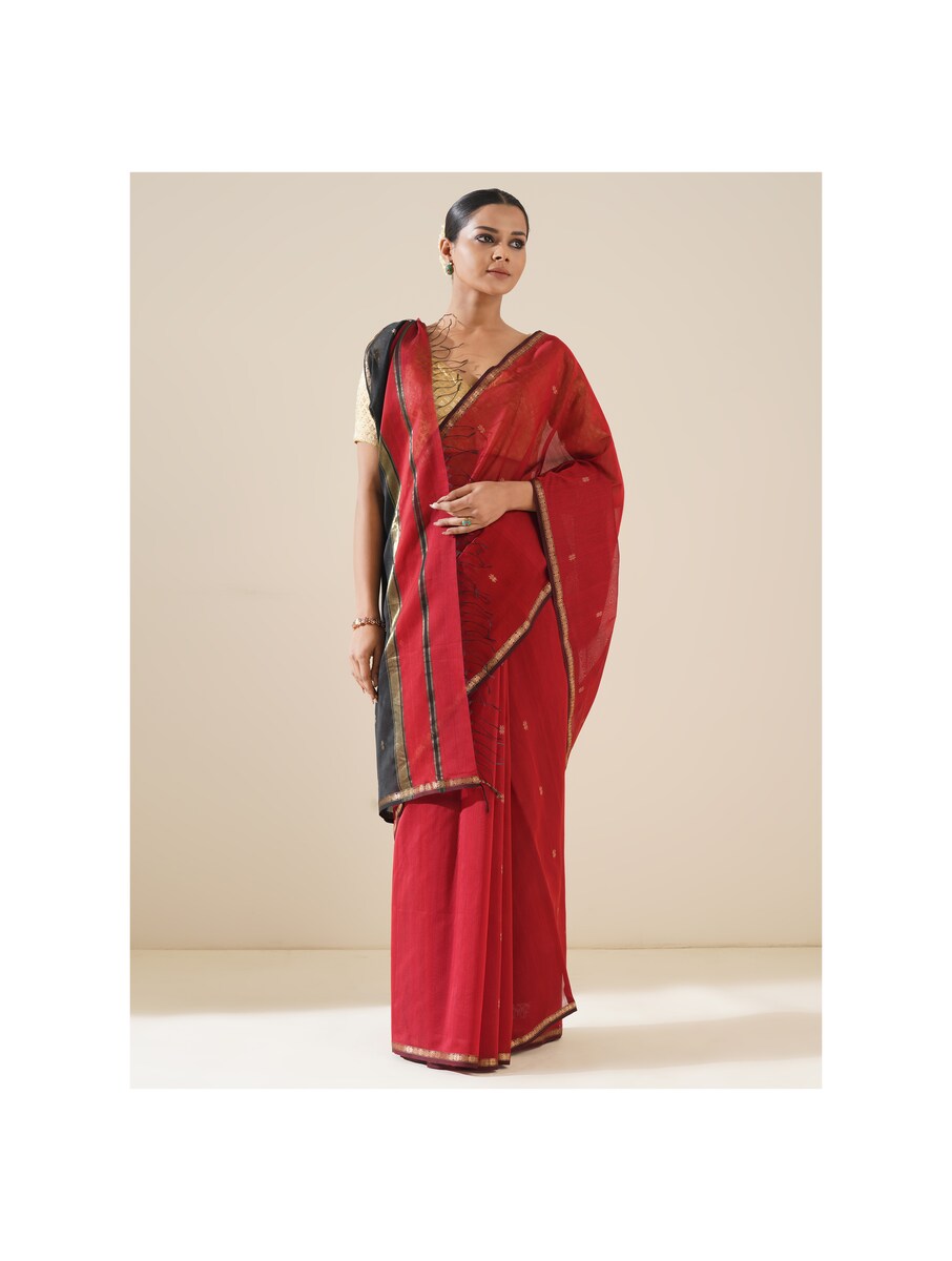 Red and black Maheshwari saree displayed on mannequin, showcasing traditional weave and fabric quality