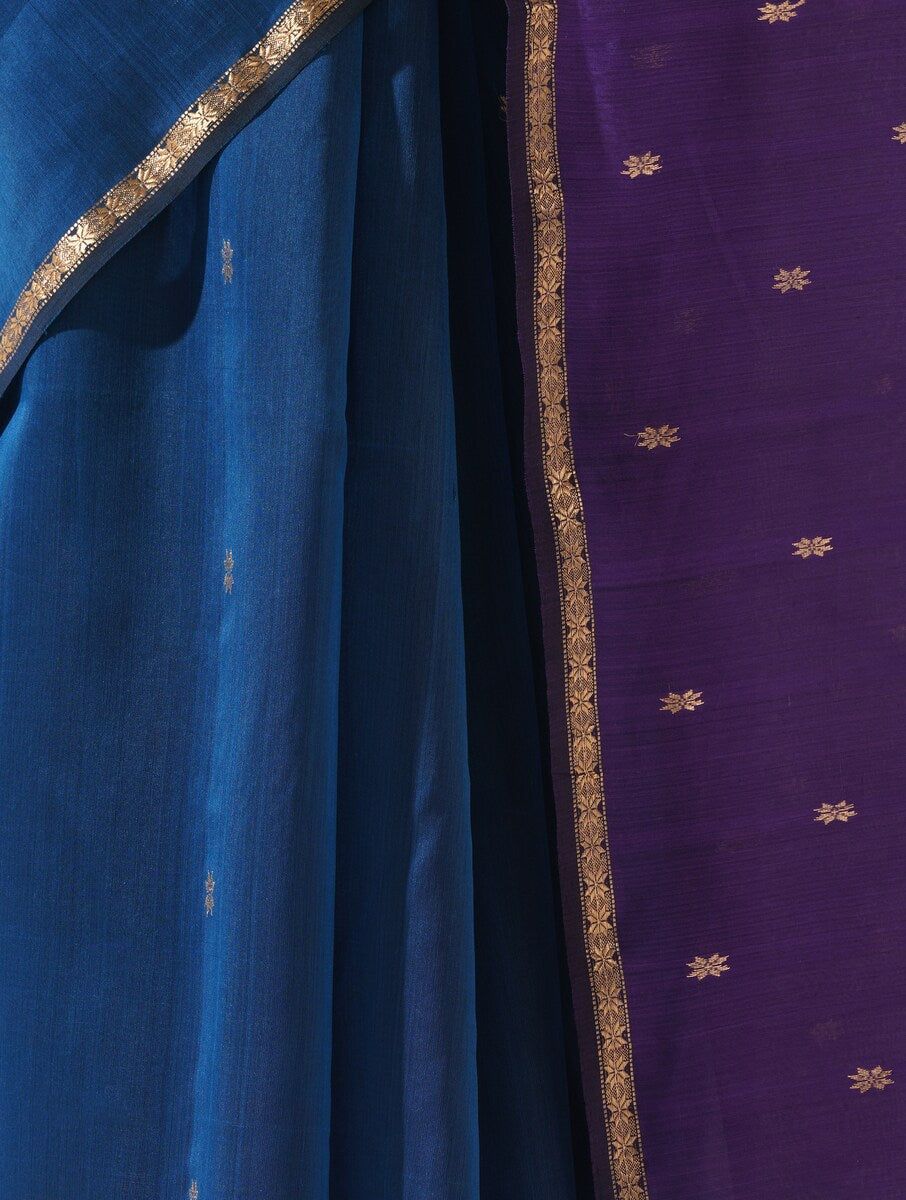Bright cobalt blue and purple saree draped neatly to highlight delicate handwoven pattern and fabric texture
