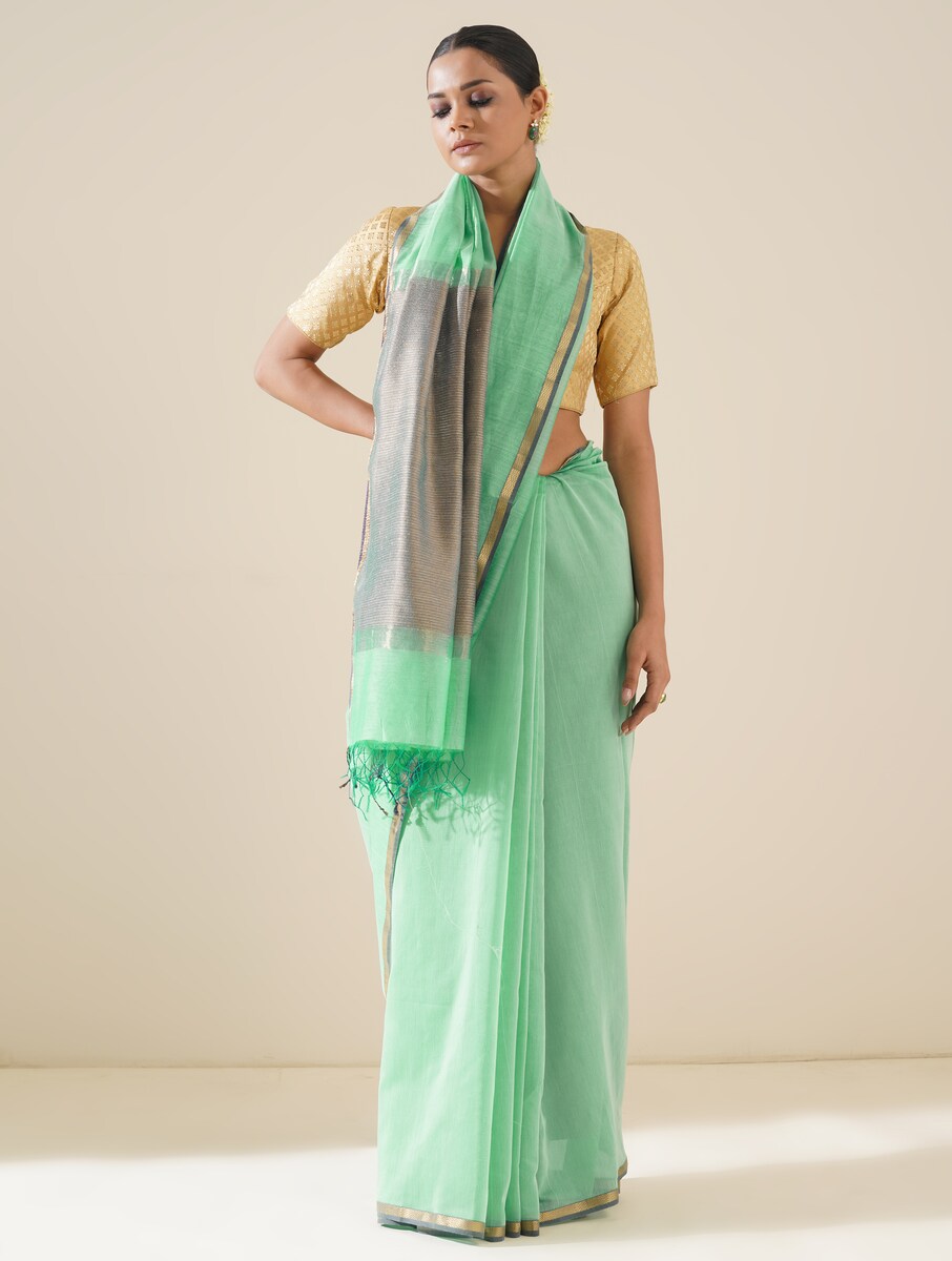 Aqua blue saree with kosa pallu arranged to showcase elegant handwoven details and silk texture