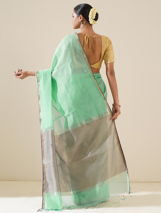 Aqua blue saree with kosa pallu arranged to showcase elegant handwoven details and silk texture