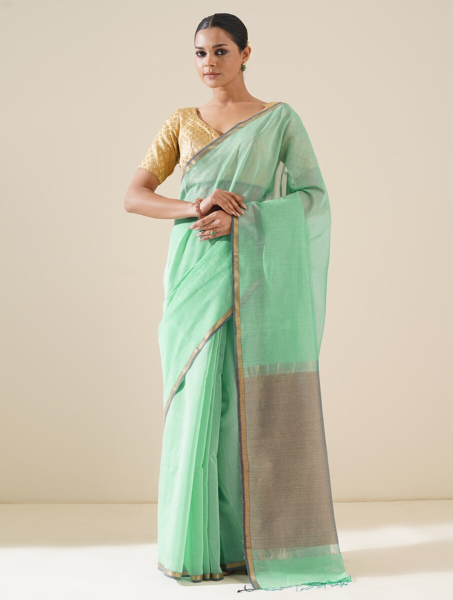Aqua blue saree with kosa pallu arranged to showcase elegant handwoven details and silk texture