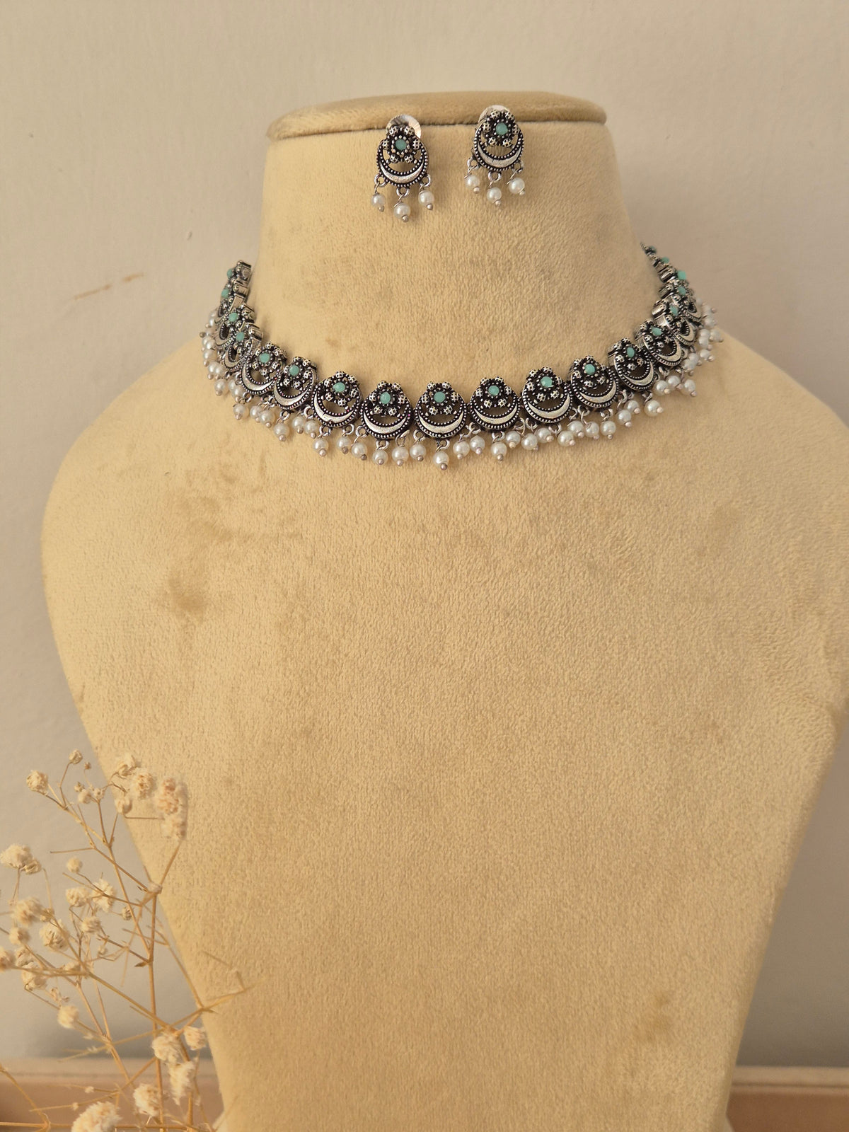 Oxidized silver choker necklace and matching stud earrings set with pearl drops. by naitri.in