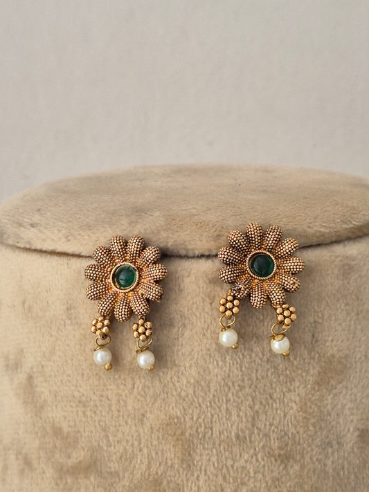 Handcrafted ethnic brass alloy choker featuring delicate pearl beads, textured gold accents, and matching earrings by Naitri.in
