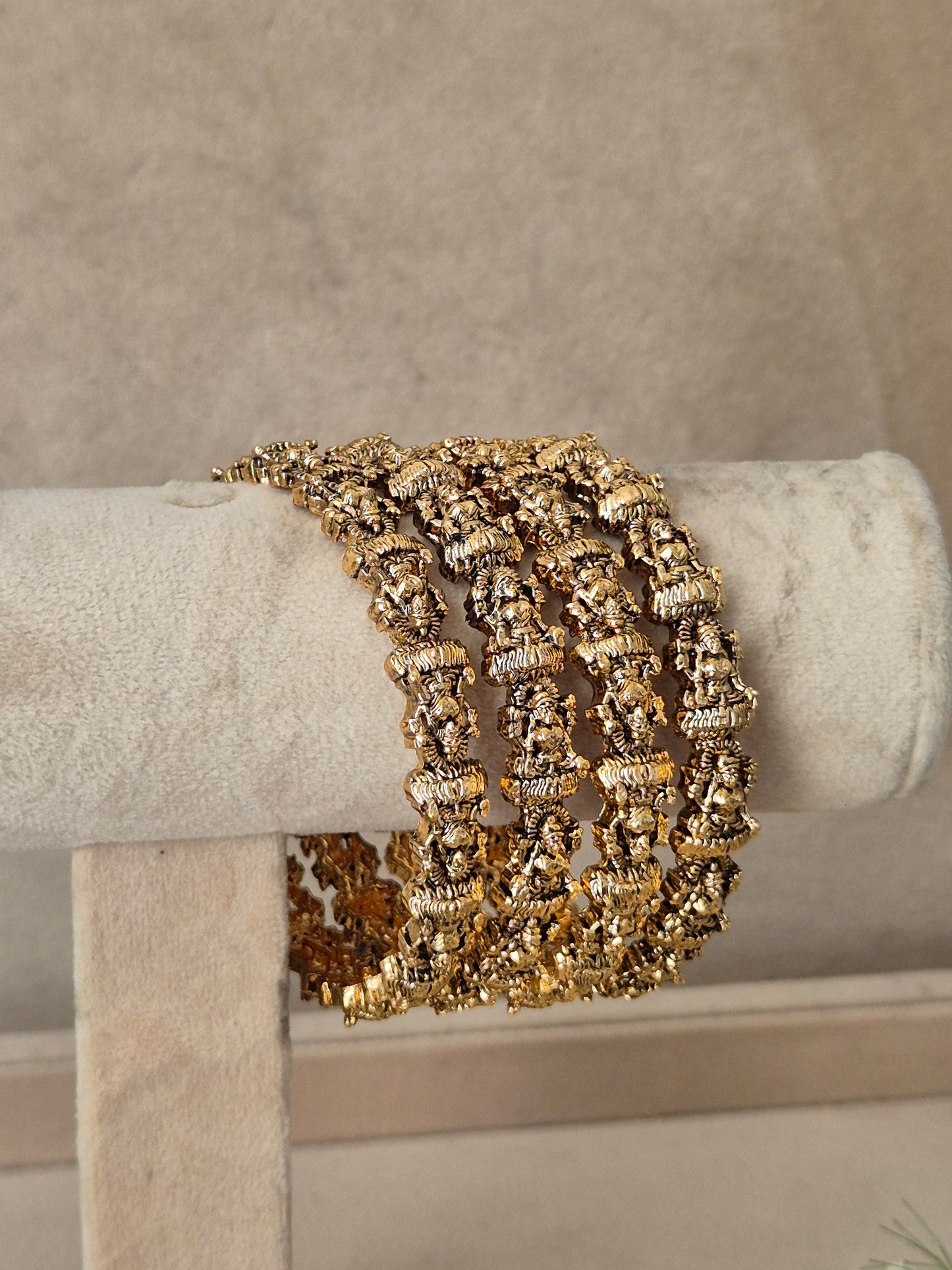 A wide, multi-strand cuff bracelet with textured gold and silver metallic links traditional gold temple jewellery bangles set of 4 by naitri.in
