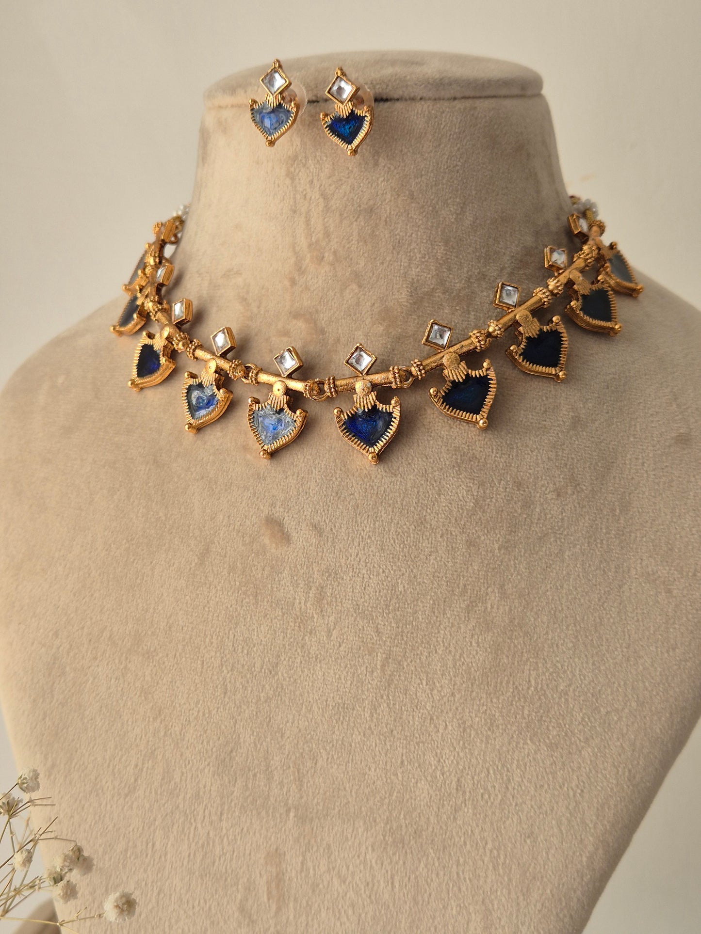 Fiya necklace and earring set with blue coloured and clear square shaped stone by naitri.in