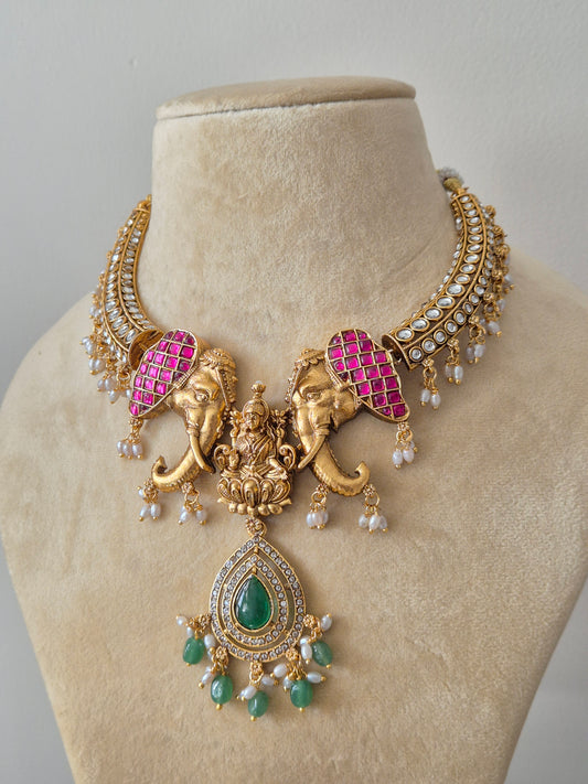 Traditional Indian Temple Jewellery featuring Gold Elephant and Lakshmi Motifs with Green and Pink Stones by naitri.in