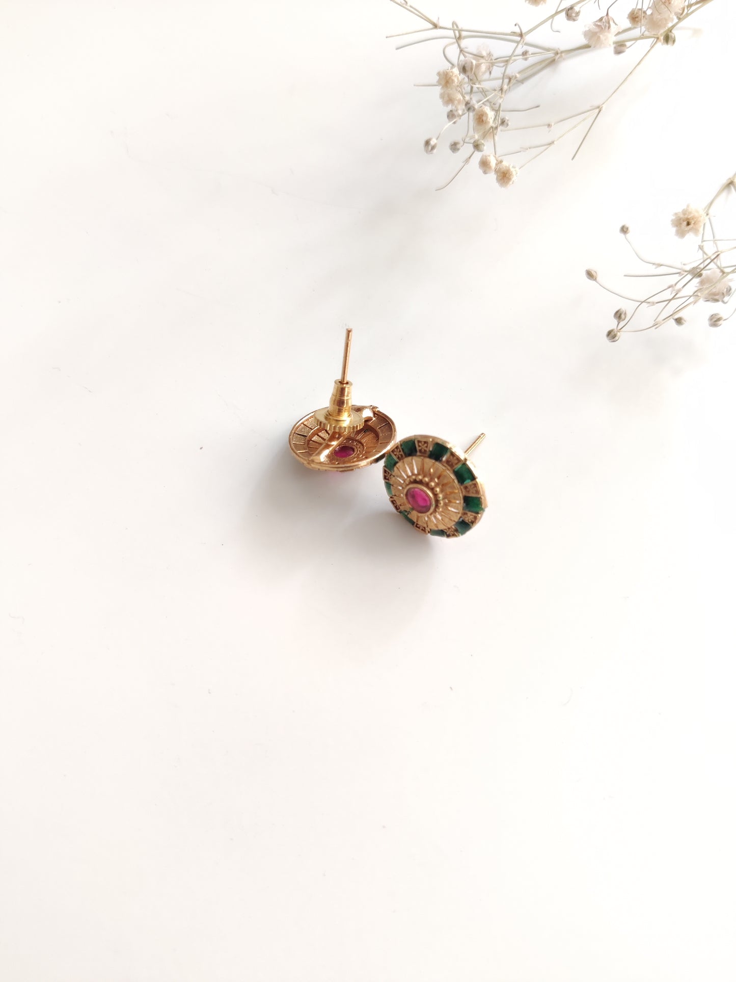 Close-up of ornate temple necklace set showcasing detailed metal craftsmanship with gold and silver tones