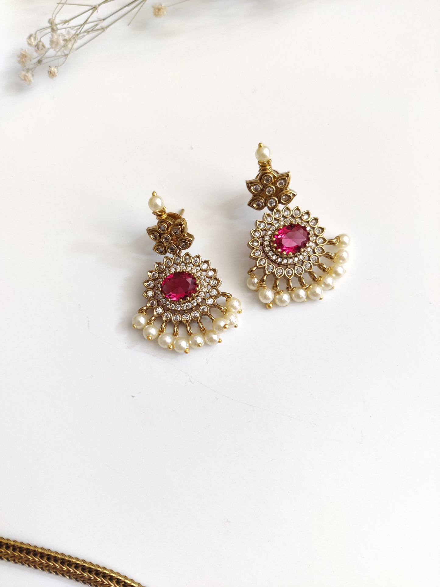 Premium temple necklace set featuring lush gold and red accents, photographed to showcase intricate design