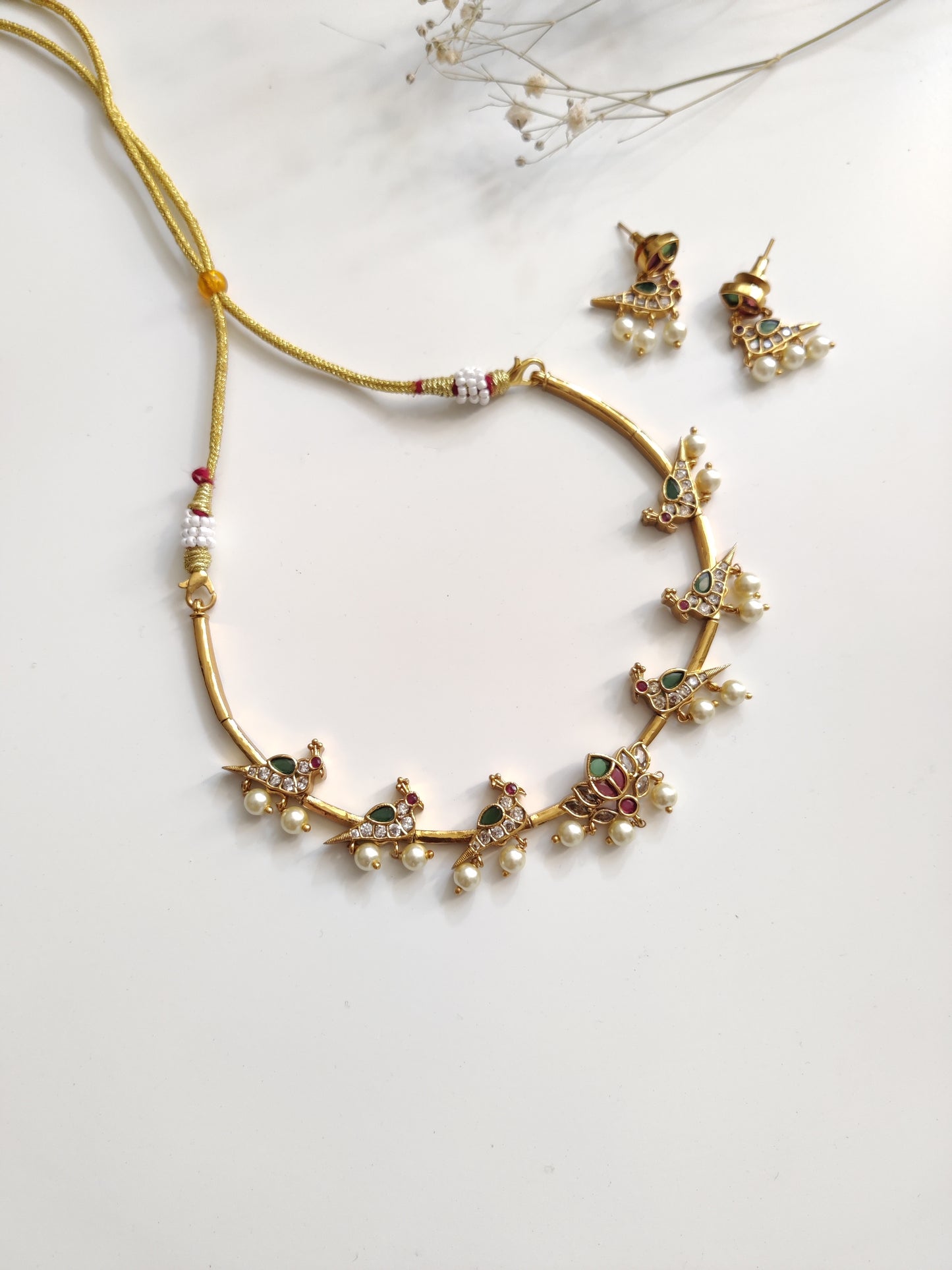 Classic gold-tone necklace set in metal alloy, photographed to highlight smooth finish and traditional look