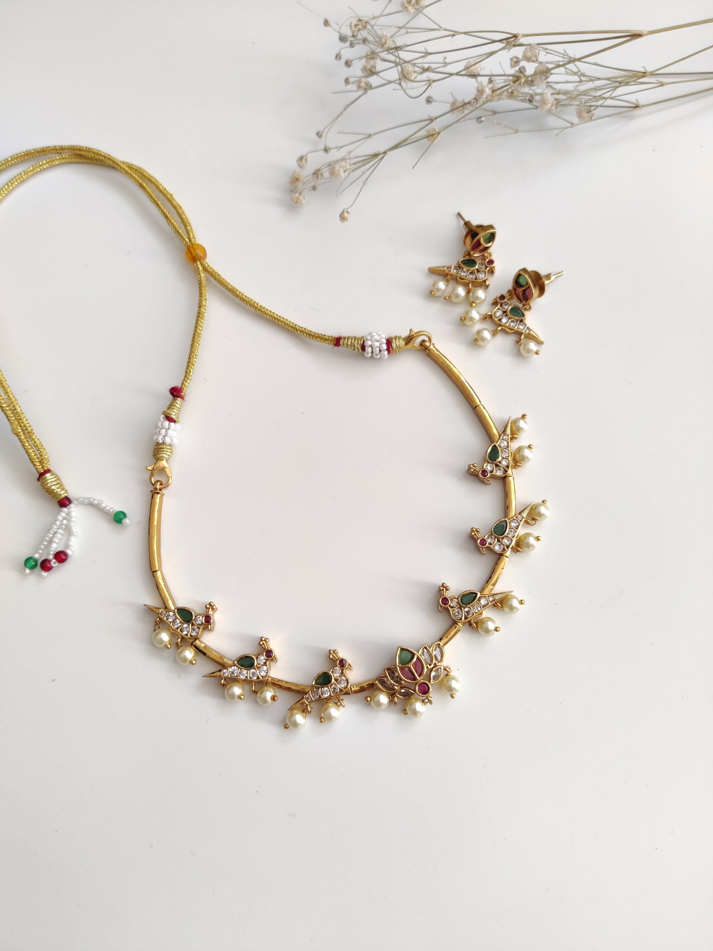 Classic gold-tone necklace set in metal alloy, photographed to highlight smooth finish and traditional look