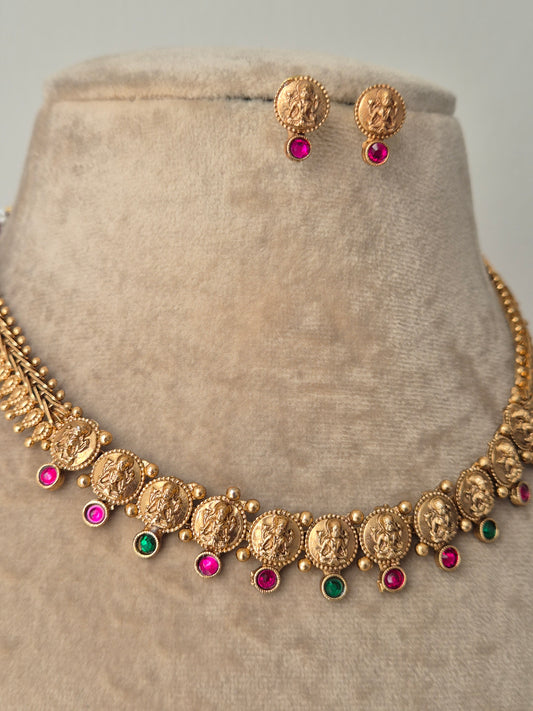 Gold necklace with colorful stones detailed goddess motifs, temple jewellery, divine sacred design by naitri.in
