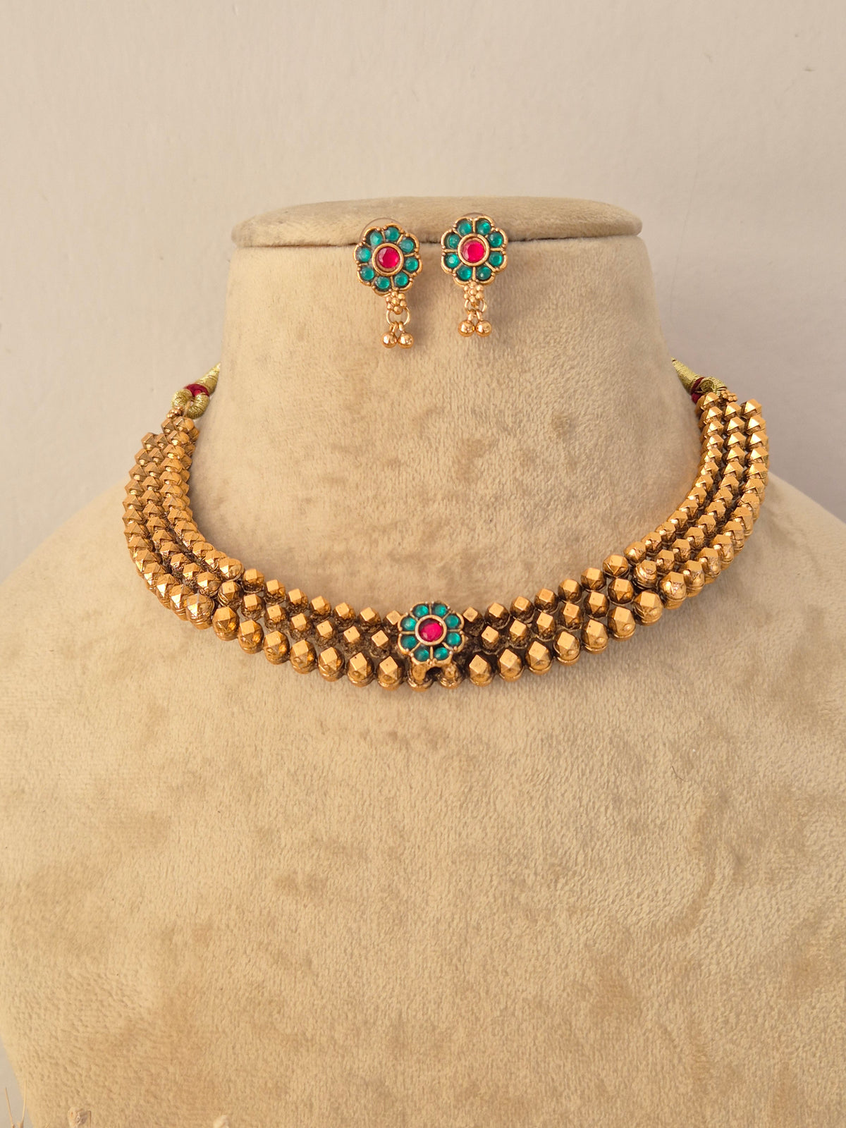 Madhuri Necklace Set with gold-toned beaded strands and matching earrings by NAitri.in