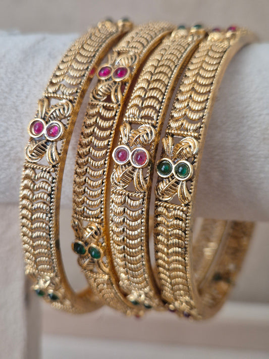 Ahilya Bangles set of 4, traditional Indian gold-plated bangles with red and green stones, ethnic festive and bridal jewelry collection by Naitri.in