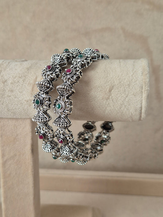 Close-up of Naitri Dhanvi premium silver oxidized bangle bracelet with traditional Indian style patterned metalwork by naitri.in