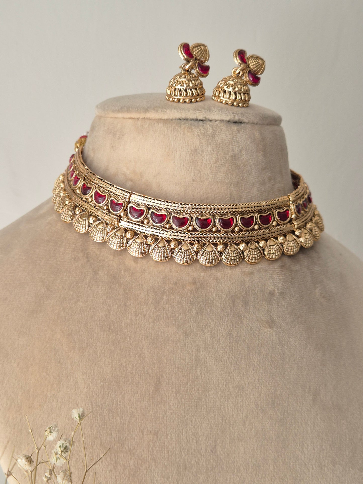 Heavy bridal gold choker set with adjustable dori closure and grand matching jhumki earrings by naitri.in